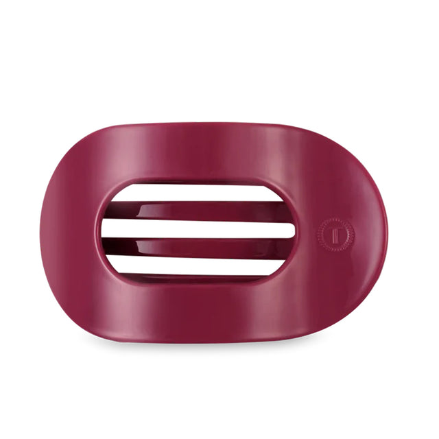 Maroon hair clip on a white background