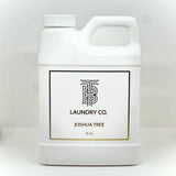 White laundry detergent container with 'Joshua Tree Laundry Co.' label on a white background