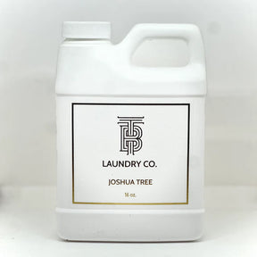White laundry detergent container with 'Joshua Tree Laundry Co.' label on a white background