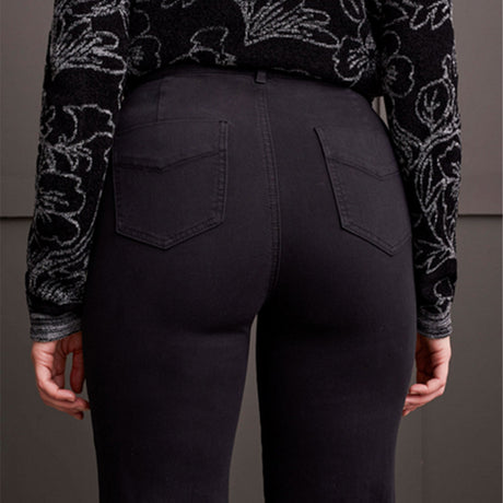 Person wearing black pants with a patterned sweater