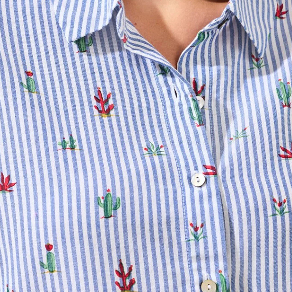 Close-up of a blue and white striped shirt with cactus patterns