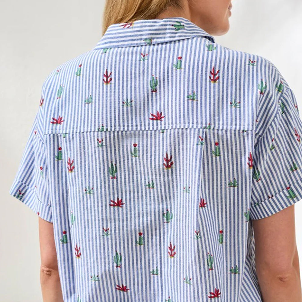 Person wearing a blue and white striped shirt with cactus pattern