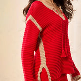 Red and beige knitted cardigan with tassel details on a beige background