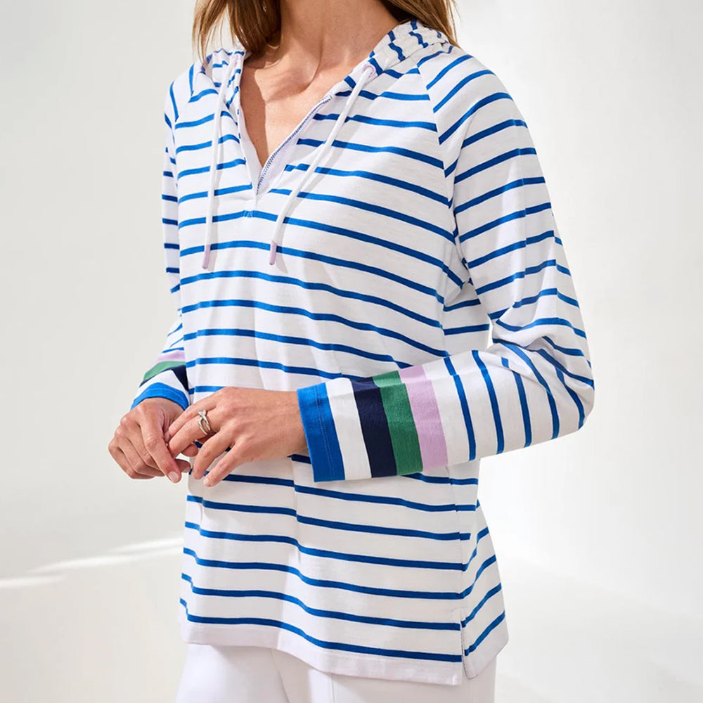 Woman wearing a blue and white striped hoodie with colorful cuffs on a white background