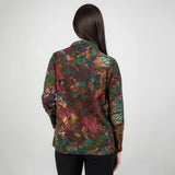 Multicolored patterned jacket worn by a person on a white background
