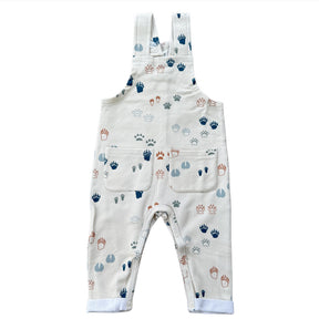 Baby overalls with paw print pattern on a white background