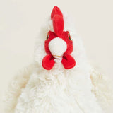Red and white plush toy on a white background