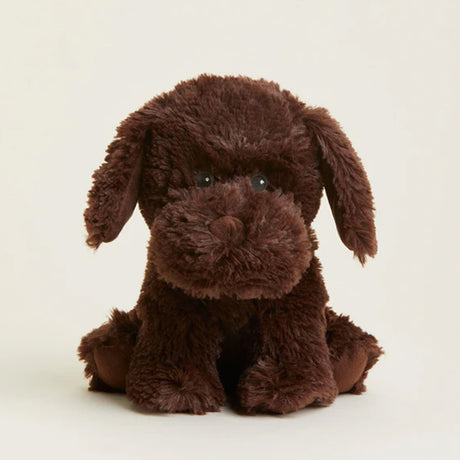 Brown plush dog toy on a beige background