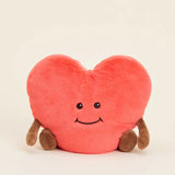 Heart-shaped plush toy with a smiley face on a beige background
