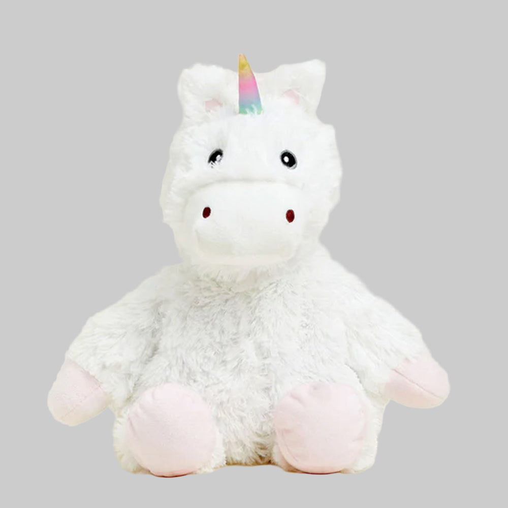 white plush unicorn with gray background